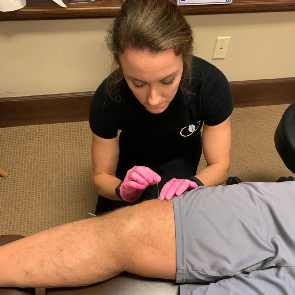 doctor adjusting patient